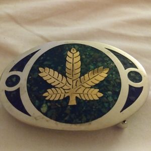 Old hippie pot leaf belt buckle.